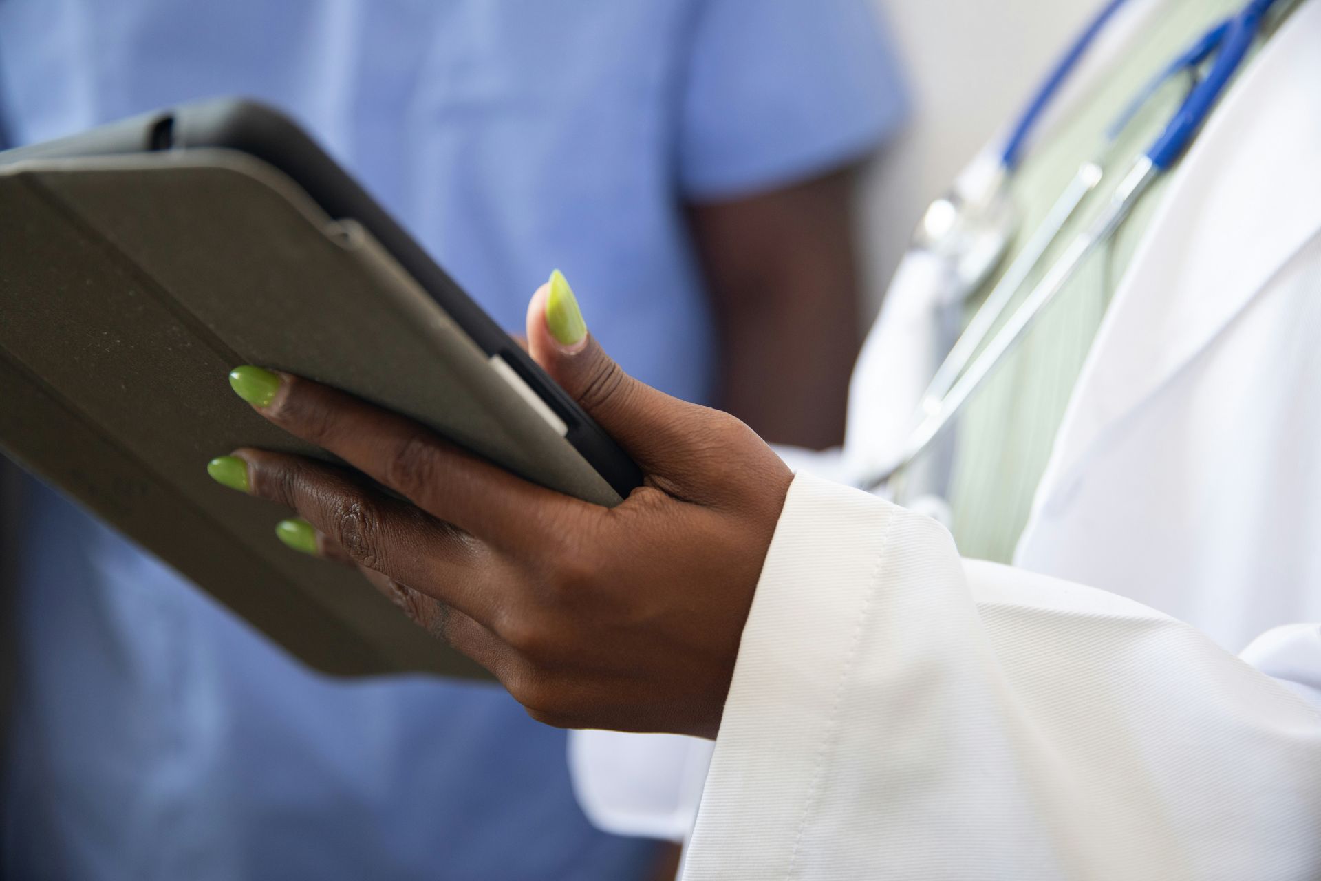 a doctor using a tablet